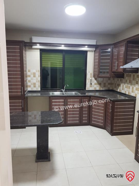 شقة ارضية مساحة 130 م مع ترس امامي 25م وكراج خاص للايجار في عمان - تلاع العلي 