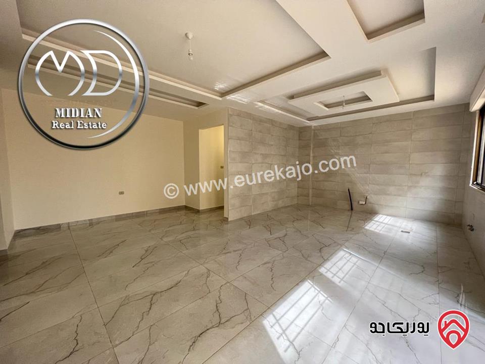 شقة أرضية جديدة للبيع في عمان - خلدا العوجانية مساحة 200م مع ترس و حديقة 150م تشطيبات ديكورات عصرية فاخرة بسعر مميز