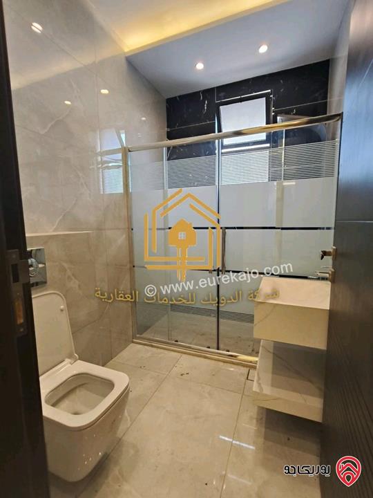 شقة جديدة لم تسكن طابق ارضي مساحة 180م داخلي و 70م خارجي للايجار في عمان - طريق المطار 