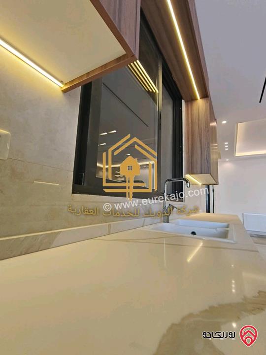 شقة جديدة لم تسكن أرضي مساحة 180م مع ترس 70م للإيجار في عمان - طريق المطار 