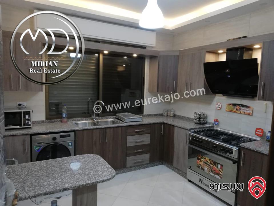 شقة ارضية مفروشة للايجار في عمان - ام السماق مساحة 130م مع ترس 100م تشطيبات و فرش سوبر ديلوكس