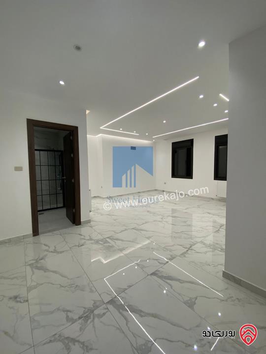 شقة أرضية 170م مع ترس 100م تشطيب سوبر ديلوكس لم تسكن للبيع في عمان - تلاع العلي