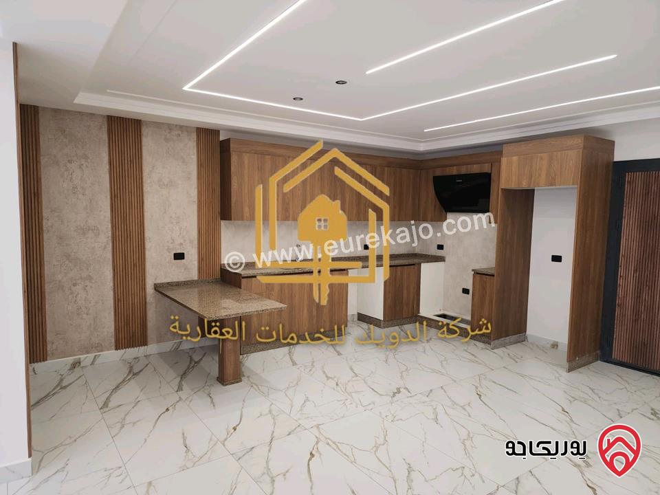 شقة جديدة لم تسكن طابق ارضي مساحة 110م مع ترس 50م للإيجار في عمان - ضاحية الرشيد 