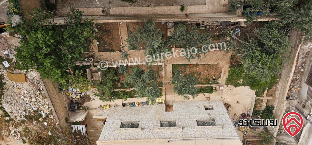 عمارة على أرض 455م للبيع في الزرقاء - حي الإسكان 