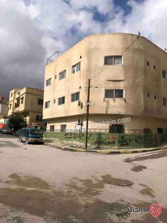 عمارة مساحة الارض 254م للبيع في الزرقاء - حي معصوم الشمالي