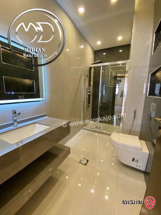 شقة شبه ارضي جديدة للبيع في عمان - ام السماق قرب الستي مول مساحة 160م مع ترس و حديقة 120م تشطيبات ديكورات فاخرة