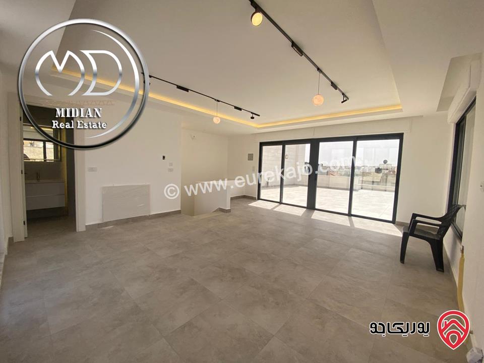 شقة دوبلكس جديدة طابق اخير مع روف للبيع في عمان - الجندويل مساحة 230م مع تراسات تشطيبات ديكورات عصرية اطلالة جميلة