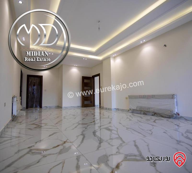 شقة شبه ارضي جديدة للبيع في عمان - تلاع العلي مساحة 185م مع ترس 50م تشطيبات سوبر ديلوكس بسعر مميز جداً