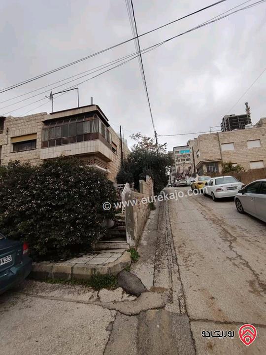 بناية سكنية وارض تحتوي على 4 شقق مقابل البوليفارد والعبدلي مول ومطلة على فندق اللاند مارك (هيلتون)  بمنطقة ممتازة للاستثمار للبيع في عمان - العبدلي